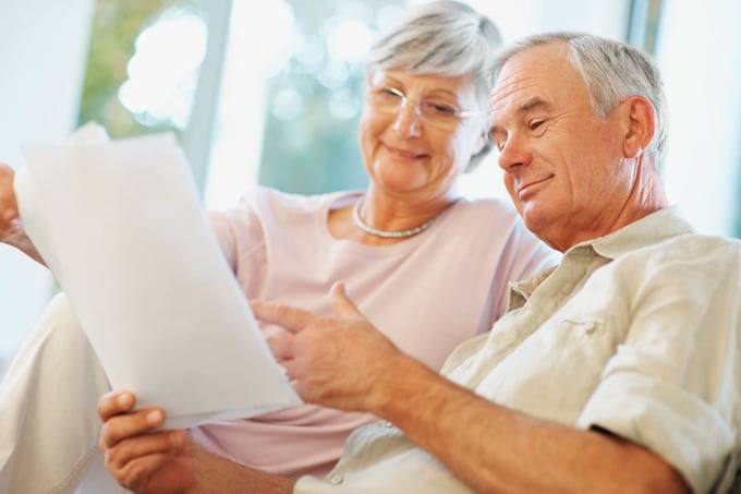 Elderly couple reading Our Approach to Selling Your Home